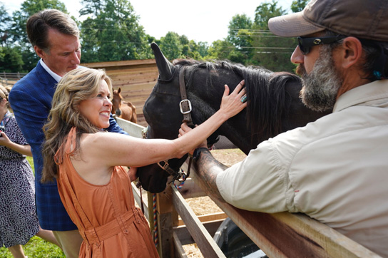 Spirit3-Event-photo1 First Lady petting horse