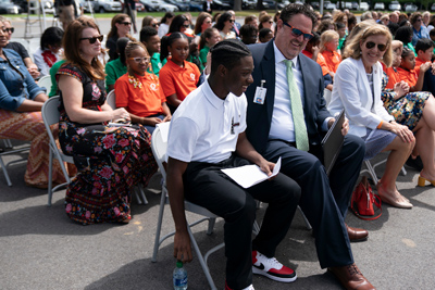 Spirit4-Event-photo1 student at podium while Governor and First Lady listens