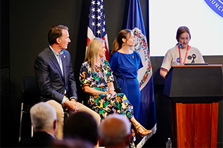 Governor and First Lady listens to remarks