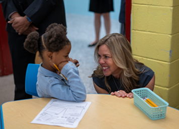 First Lady with young student